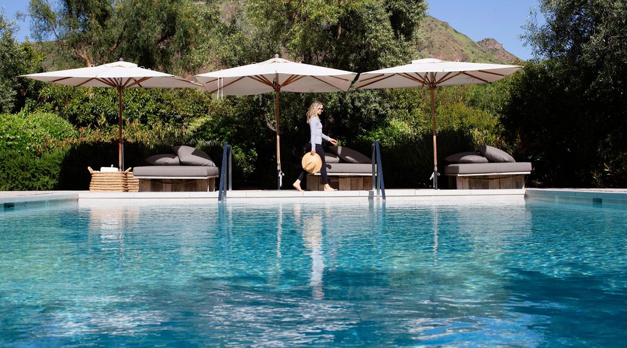 Expansive outdoor pool, infrared sauna, and hot tub spa.