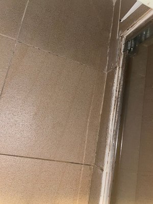 Dirty bathroom tiles.
