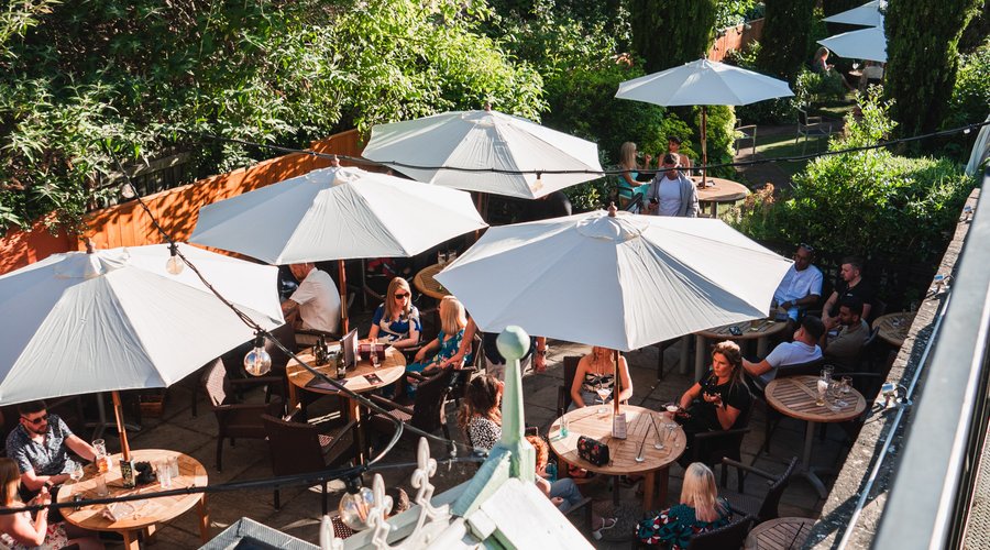 The garden is a charming outdoor sanctuary with a serene ambiance, featuring a generous design and stunning vistas of the renowned viaduct. The seating arrangement in the garden encourages guests to relax with their drinks and bask in the sunlight.