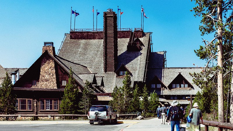Tourists outside Old Faithful Inn, Yellowstone