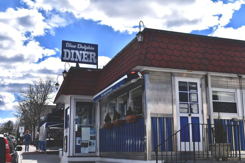 Exterior of diner with blue and metal wall