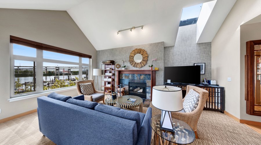 Full kitchen, living room with fireplace, dining area and balcony