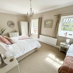 One of the two bedrooms in Turkeytree Cottage (super king & single or 3 single beds)