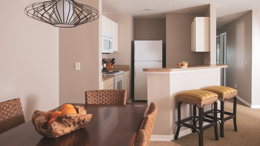 Dining room table and full kitchen.