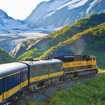 The Alaska Railroad in Alaska riding through the mountains in Alaska.