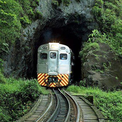 The Serra Verde Express coming out of a tunnel in Brazil