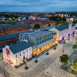 The 4 Star, Ebrington Hotel is built within a former army barracks, dating from 1841 and is in the heart of Derry City on Ebrington Square, directly overlooking the Peace Bridge, only 5 minutes stroll from the guildhall square. The hotel is a blend of listed buildings and new modern architecture linking the past & the present with amazing, elevated views across the river Foyle & entire Derry landscape making it one of the coolest places to stay in the city. 