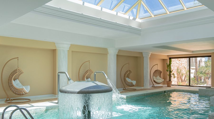 The Elixir Spa Facilities include indoor pool 75 m² with hydromassage bathtub, fitness room with various equipment, 3 private massage rooms, sauna, beauty salon, hairdresser, fitness aerobic area, changing rooms, personalized treats including special facials, body treatments, and massages.