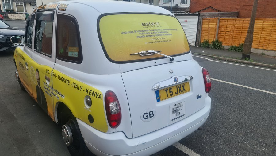 My cab driving off 
