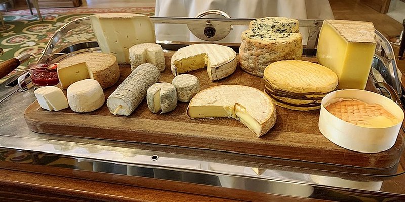Large tray of various cheeses