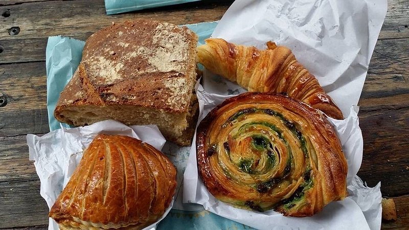 Four pastries, including croissant and snail