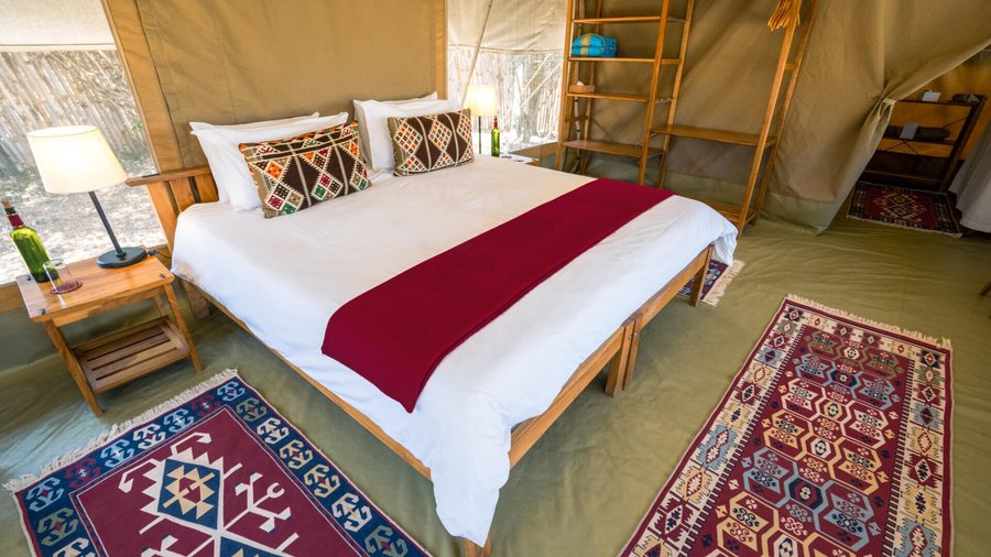 There are seven tents (including one family tent) at Ol Pejeta. Each has an en suite with flushing toilets and hot water bucket showers. Beds are snug with extra blankets and a hot-water bottle slipped in during turndown. The tents have spacious decks where guests can while away a few hours in the afternoon, just listening the sounds of the bush. 