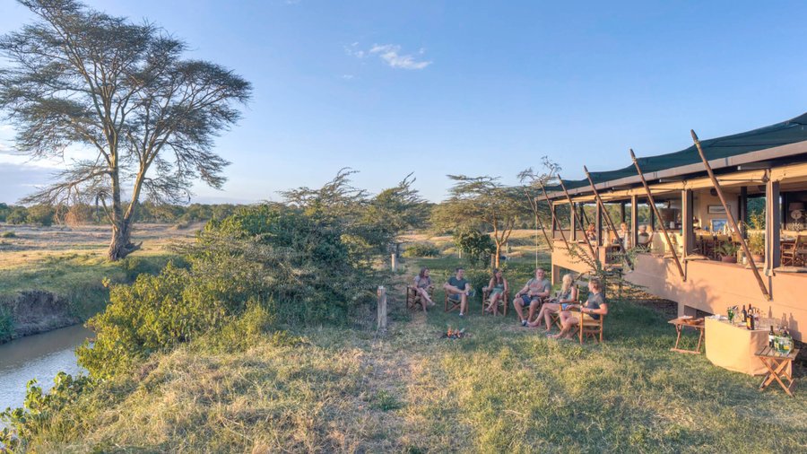 Ol Pejeta Bush Camp is a relaxed tented camp set along the narrow Ewaso Ngiro River. The main mess tent overlooks the Ol Pejeta plains on the other side of the river. Sip your morning coffee while watching weaver birds flutter around the fever trees outside and spend evenings with a glass of wine by the fireplace. The campfire is where guests can gather to share stories and get to know one another after the afternoon game drive. 