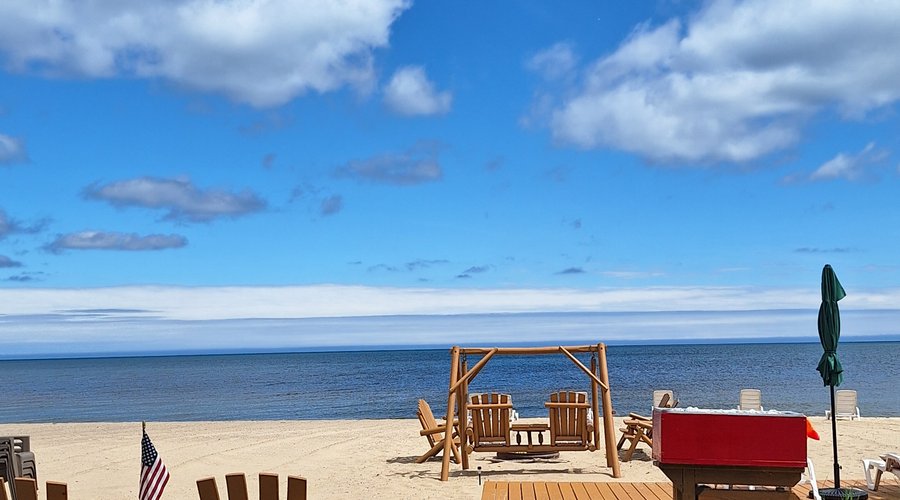 Young's Beachfront Resort, Tawas City, Michigan.  Sandy Beach Cabins, Private Beach Resort.  Sand Beach Getaway on Lake Huron, Tawas Bay.  Northeast Michigan.  Up-North Cabins/Cottages.  Tawas City Hotels and Motels.  989-362-2366.  tawasyoungsgetawayresort.com