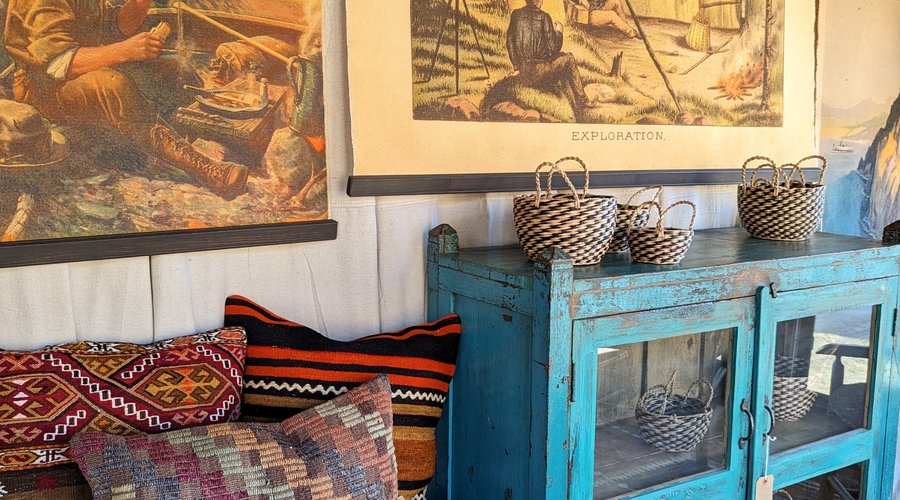 The Morning Coffee Wall Chart, Colvin Camp Wall Chart, Hickory Bench in Vintage Kilim, Vintage Kilim Pillows, and Seagrass Storage Baskets