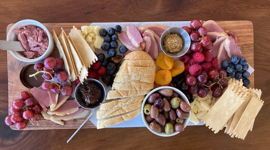 The Boardroom Ferndale's Combo Board is a huge meal for one, or a great appetizer for the table! Made with international imported ingredients and cheese made from local milk!