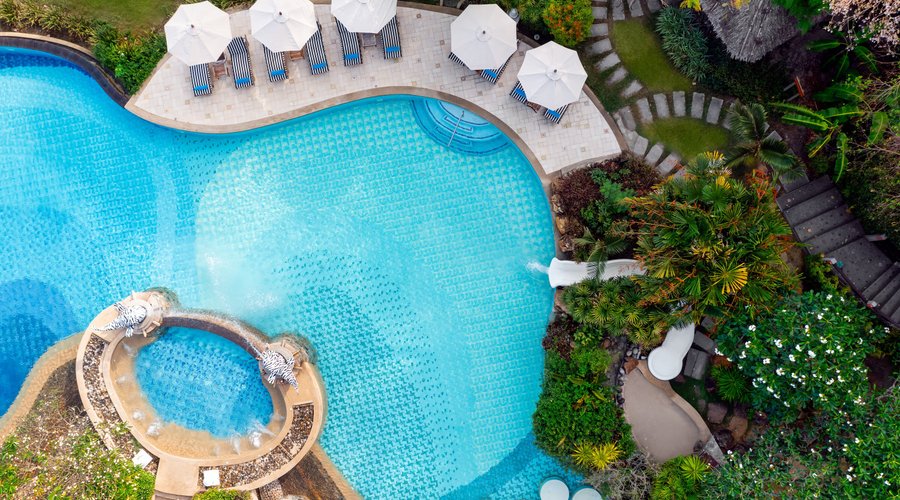 Enjoying swimming pools while escaping to a pristine private beach