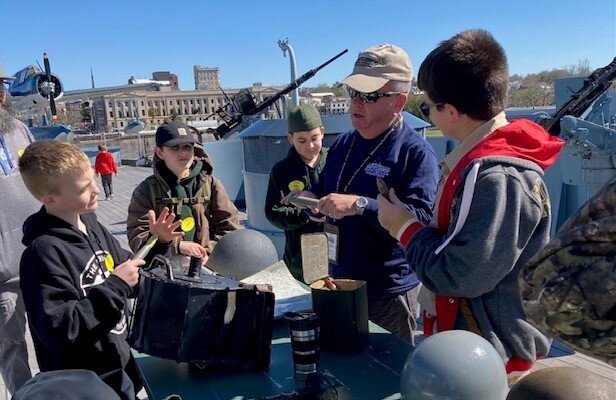 Battleship 101
Friendly, knowledgeable volunteers stationed throughout the Ship engage visitors in specific subjects and areas such as gunnery, sick bay, engineering, and daily shipboard life. Enjoy the opportunity to go behind the doors and inside normally closed spaces. Hands-on opportunities for the young and young at heart! This event is perfect for families and scout/youth groups. Offered as free program with Battleship admission.  Check for dates:  https://battleshipnc.com/programs-and-eve