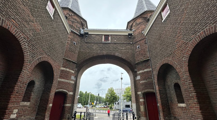 Crossing the moat and walking through the ancient city gates of Amsterdamse Poort.
The Amsterdamse Poort  looks much the same as it did centuries ago. You can still walk through the ancient gateways, just as you could almost 700 years ago. 
