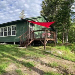 Side view of cabin and deck from lake side.   