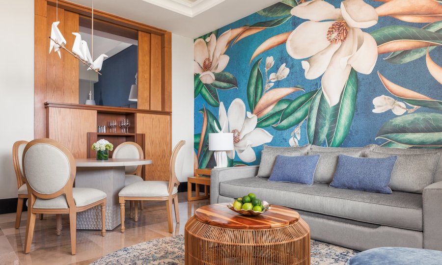 One-Bedroom Suite - Plush Living Room An expansive haven of your own, our one-bedroom suite features stylish living areas, the convenience of a fully equipped kitchenette, and panoramic park views, promising the comfort of home blended with unmatched luxury.