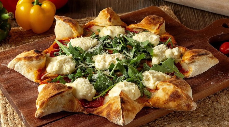LA STELLA - Our signature 8-pointed star fresh perfectly baked sourdough stuffed crust pizza, topped with pepperoni, turkey ham, arugula, tomato sauce, mozzarella, and homemade burrata cheese.