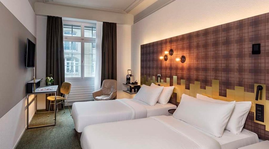 NH Bern The Bristol Room superior curtains open twin king size bed view tv