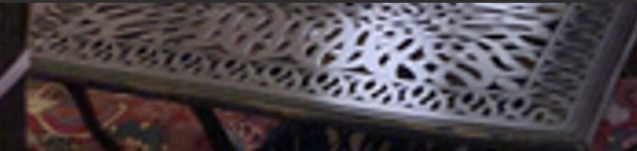 Metal table with perforated surface