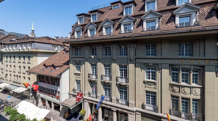 NH Bern The Bristol Facade day main gate terrace flags windows