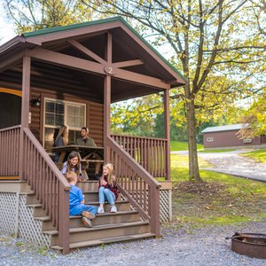 All cabins feature basic amenities such as electric, heat, and AC, as well as restrooms and showers that are located nearby and available mid-April through late October. Our deluxe cabins feature a kitchenette.