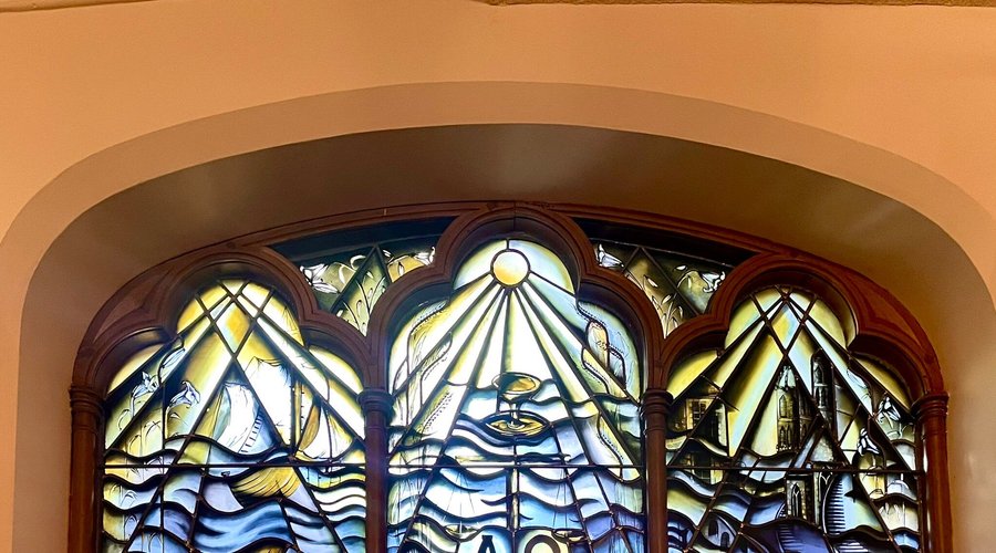 Not only are the stained glass windows beautiful, but so is the artfully crafted lattice woodwork upon the domed ceiling.