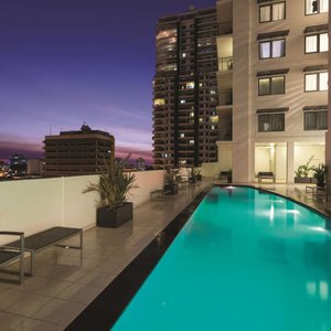 Illuminated outdoor swimming pool at night