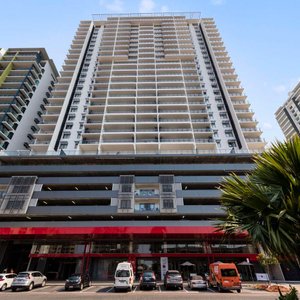 Wide view of the hotel's exterior from the entrance