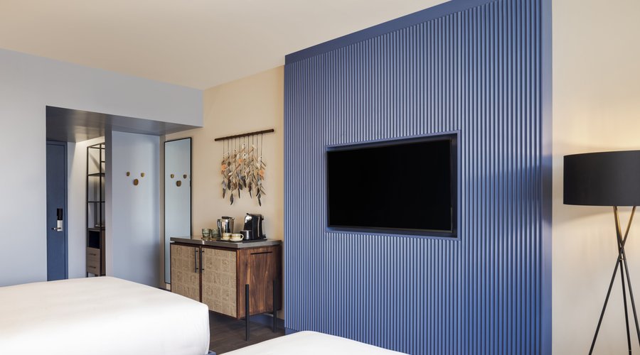 Find the perfect spot to relax in this 26- to 28-square-meter room with two queen beds. The upbeat ambiance lends a stylish yet playful aesthetic that captures Costa Rican culture. A comfortable living space features a 55-inch flat-screen HDTV. The sleek bathroom includes a walk in-shower, plush bathrobes and branded amenities. Connecting room available. 