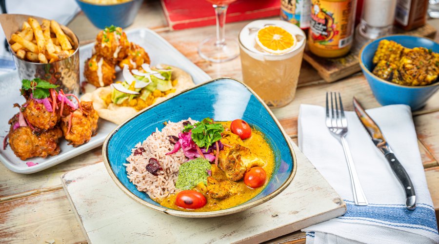Serving up fresh Caribbean-inspired flavours, 2-4-1 cocktails at Happy Hour and our famous Bottomless Brunch. Relax and enjoy warming curries, our iconic smoky jerk pit, vibrant small plates and Reggae Roasts on Sundays. Our iconic mix of rum, reggae and jerk is perfect way to escape somewhere tropical for a while. 
