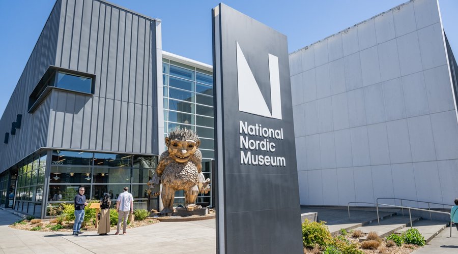 Frankie Feetsplinters welcomes visitors outside the entrance to the National Nordic Museum.