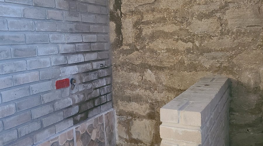 The shower, no hot water available despite the "red " spot painted on the stone