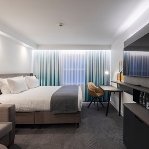 The premium room is a sanctuary of comfort and sophistication, where every detail has been carefully considered to ensure an unforgettable stay. Guests will revel in the luxurious finishes, including rich gold accents that add a touch of opulence.