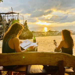 My friends at the bar next door in front of the amazing driftwood bar! 