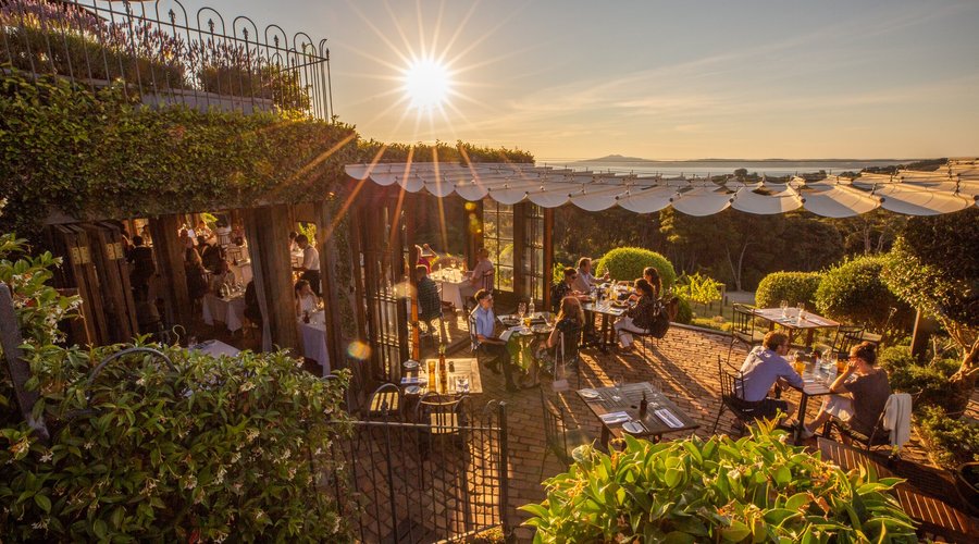 Guests dining outdoors in the Mudbrick Restaurant