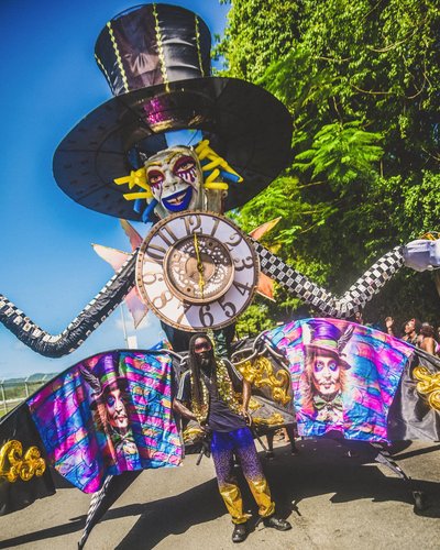  A man dressed in a giant clock costume during a carnival parade