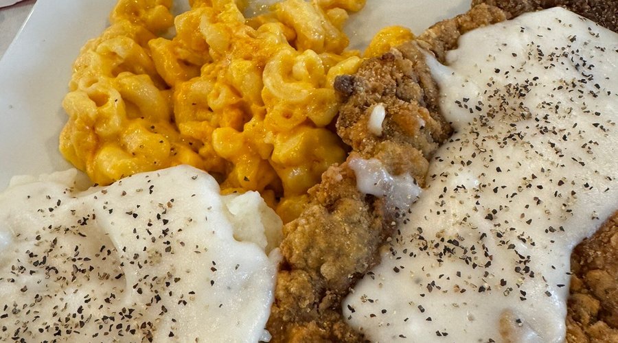 Yummy comfort food - chicken fried steak with mashed potatoes and macaroni and cheese.