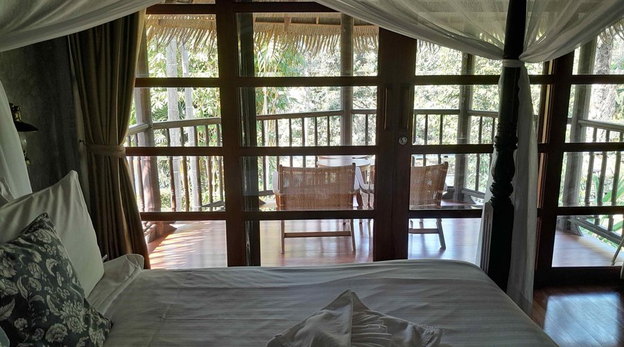 bedroom, looking out to the balcony and beyond