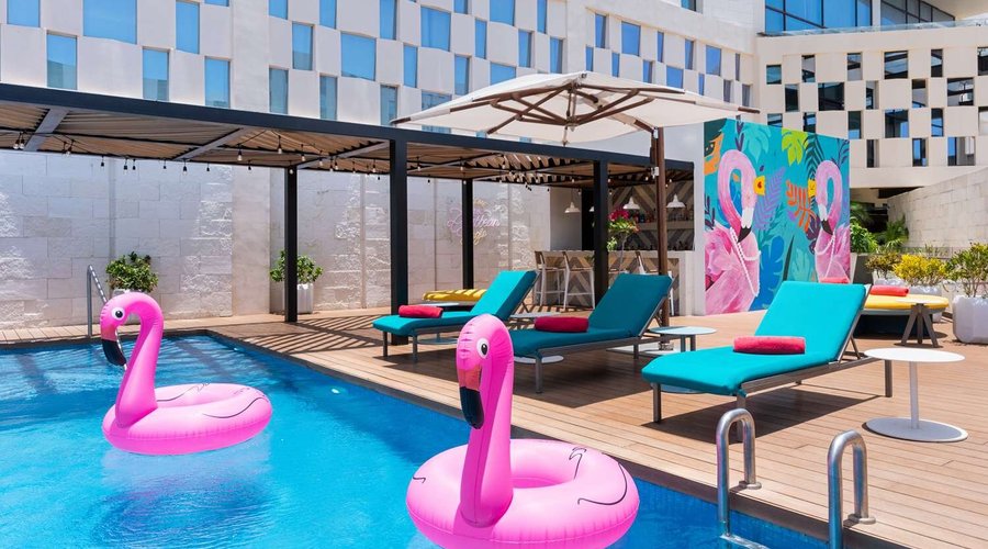 Avani Cancun Airport Hotel Pool mural flamingo