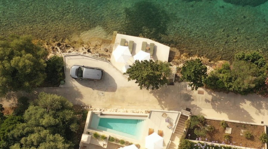 Stunning overhead shot of Stowaway Villa and its waterfront location.