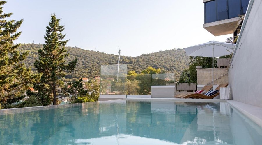 Serene poolside retreat, perfect for relaxation.