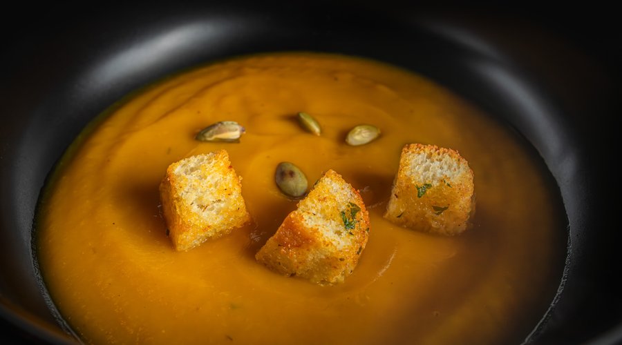 Pumpkin & Pejibaye Cream. Velvety pumpkin and pejibaye cream, topped with toasted pumpkin seeds and crispy croutons.
