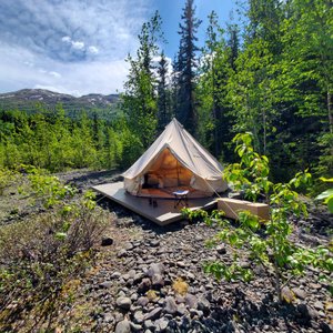 Eklutna Lake Booking by Alaskan Glamping- Glamping Tent with Queen Bed on platform.