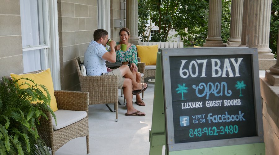 Savor your morning coffee on the inviting front porch of 607 Bay Inn, where you can relax with views of Cannon Park and the Intracoastal Waterway. Watch the charming historic swing bridge open as you enjoy the peaceful coastal atmosphere—an ideal start to your day!