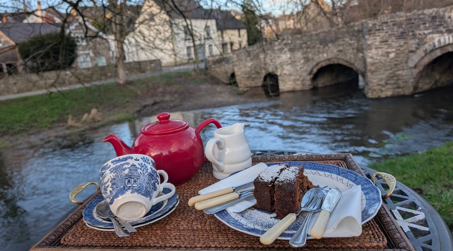 Tea and cake... And river, and ancient bridge, and village atmosphere,  and blue skies, and good company, and... All at The Postcard Cafe, Clun! 🤩